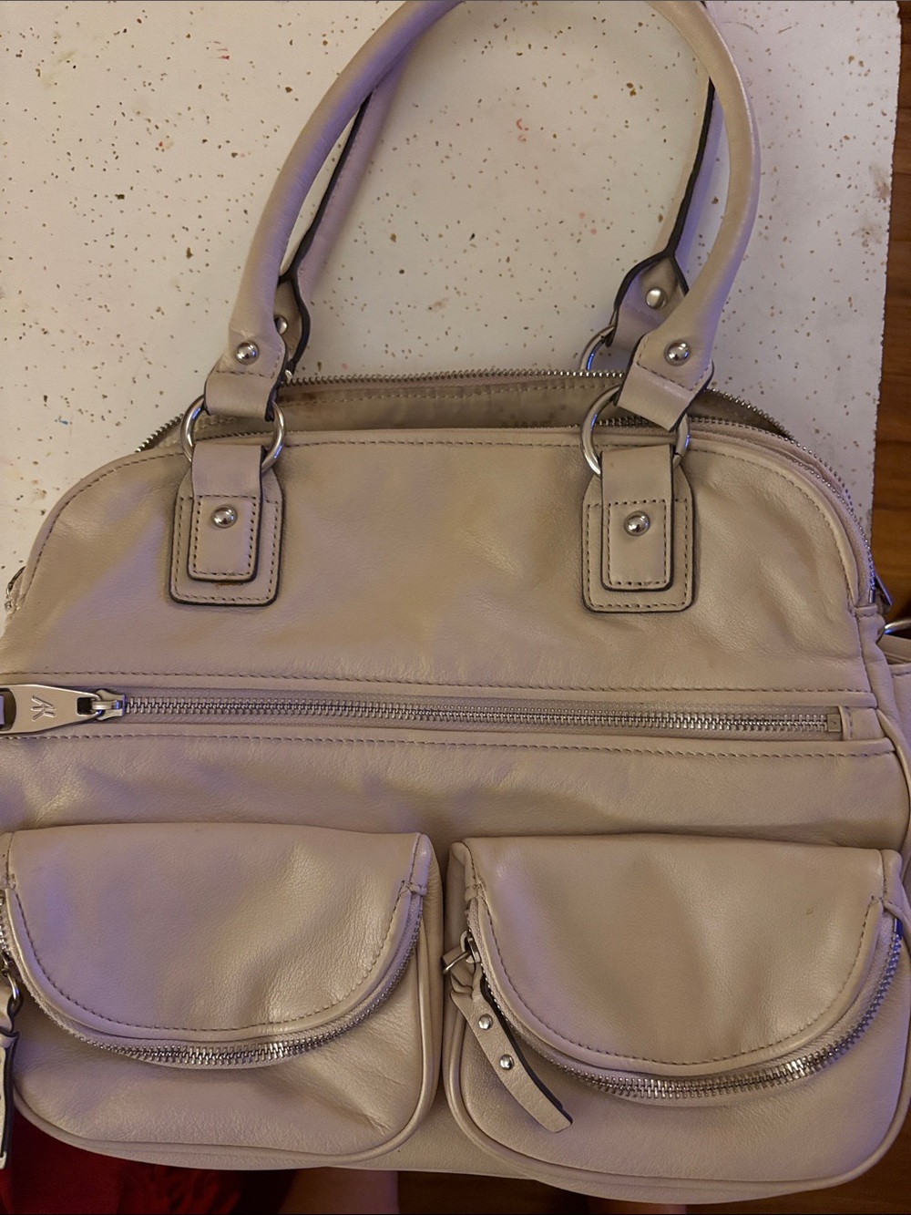 Aimee Kestenberg beige leather purse.